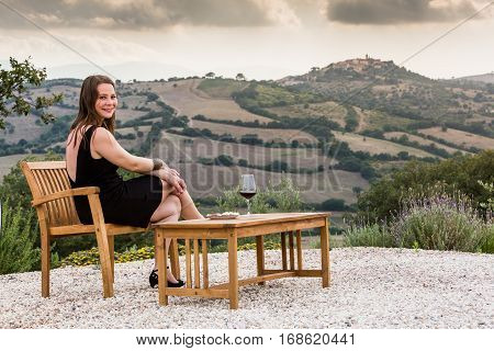 Girl With A Glas Of Wine At Sunset In Tuscany, Italy