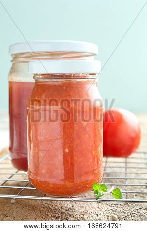 Homemade tomato juice in a glass jar.
