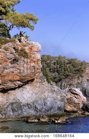 Summer hiking in the mountains with a backpack .