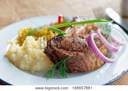 Grilled pork ribs with sauerkraut and mashed potatoes - hearty dish