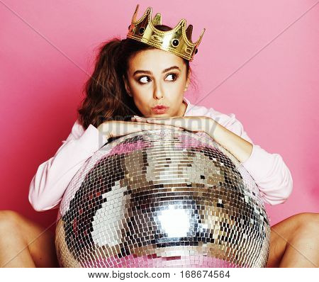 young cute disco girl on pink background with disco ball and crown smiling adorable emotions