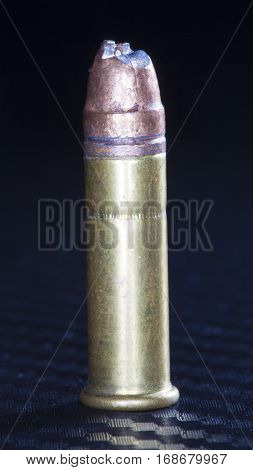 Rimfire cartridge with a bullet that has been cut