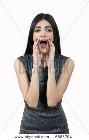 Young Woman Shouting Through Megaphone Shaped Hands