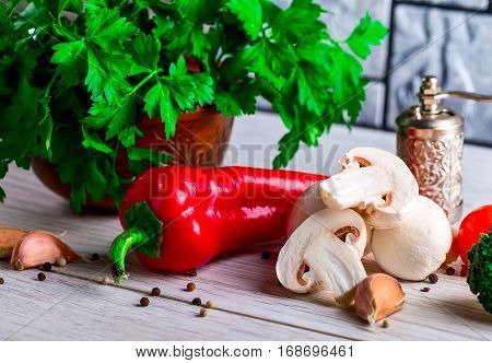 Sliced agaricus on a wooden Board. The process of cooking mushrooms