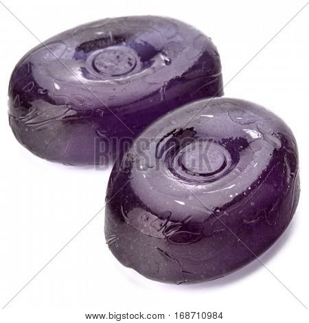Two colorful fruit hard sugar candies,  boiled sweeties or sugar plums isolated on white background cutout.