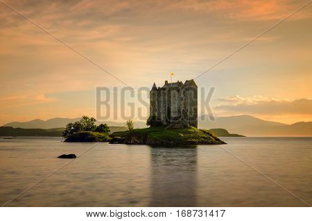 Stalker Castle in yellow evening light Highlands Scotland
