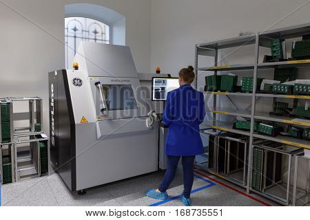ST. PETERSBURG, RUSSIA - NOVEMBER 2, 2016: Woman at X-ray inspection system on the production site of StarLine company. It is one of the leading company on the automotive security market of Russia