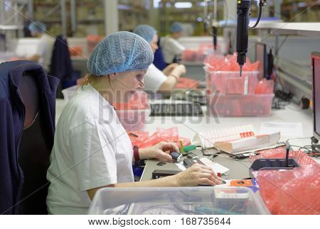 ST. PETERSBURG, RUSSIA - NOVEMBER 2, 2016: People at work on the production site of StarLine company. It is one of the leading company on the automotive security market of Russia