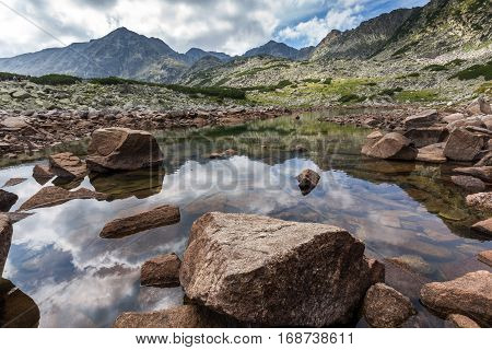 Reflection of Irechek and Musala peak in Musalenski lakes,  Rila mountain, Bulgaria