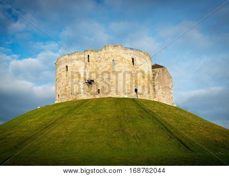 Small castle on a hill in a small town
