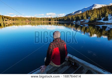 Man on mountains lake