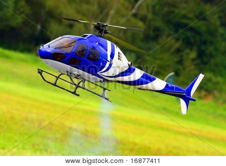 Flying helicopter (radio controled scale-model 1:24 scale) Teleobjective shot with shallow DOF.