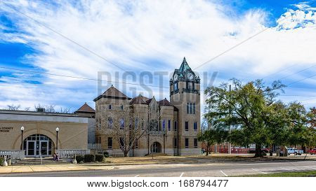 Prattville Alabama USA - January 28 2017: Landscape view of the Autauga County Courthouse with the annex with a dramatic blue sky with clouds.