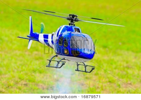 Flying helicopter (radio controlled scale-model 1:24 scale) Teleobjective shot with shallow DOF.