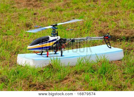 Flying helicopter (radio controlled scale-model 1:24 scale) Teleobjective shot with shallow DOF.