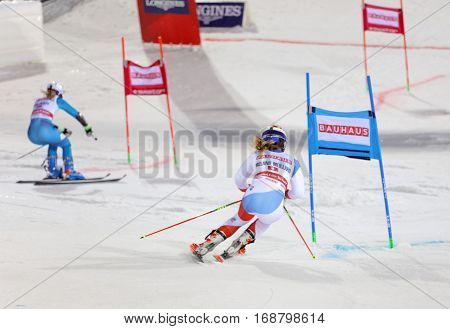 STOCKHOLM SWEDEN - JAN 31 2017: Side view of Melanie Meillard (SUI) and competiotor in the downhill skiing in the parallel slalom alpine event Audi FIS Ski World Cup. January 31 2017 Stockholm Sweden