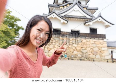 Woman taking selfie in Hikone castle
