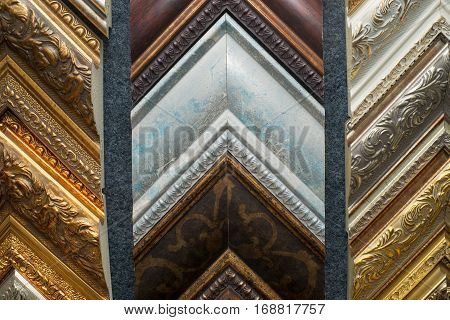 Craftsman working on frame in frame shop. Professional framer hand holding frame angle. Top view.