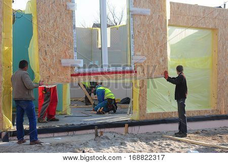 KIEV UKRAINE - January  23 2017: Builders Install SIP panels for New Frame House Construction. SIP panels good for energy efficient building systems.