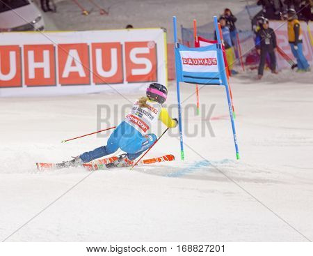 STOCKHOLM SWEDEN - JAN 31 2017: Rear view of Frida Hansdotter (SWE) in the parallel slalom downhill skiing at the Alpine Audi FIS Ski World Cup - city event January 31 2017 Stockholm Sweden
