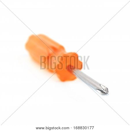 Tiny crosshead screwdriver with a plastic orange handle, isolated over the white background
