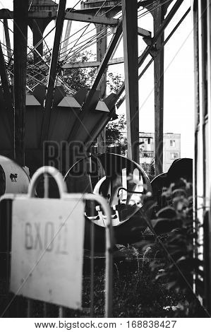 Entrance to the abandoned children's attractions, black and white.