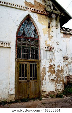 The door of the old distillery with the glass elements in the form of an arch.