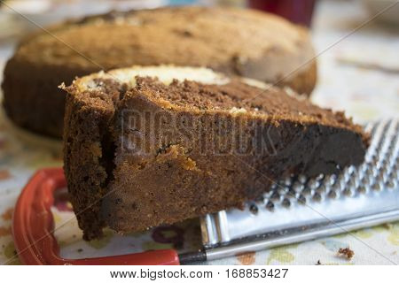 slice of homemade vanilla and chocolate sponge cake