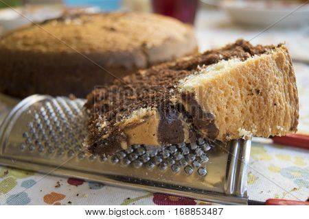 slice of homemade chocolate and vanilla sponge cake