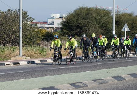 Nahariyya Israel - February 04 2017 : Group of cyclists on a winter morning trains on intercity road near Nahariyya Israel