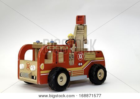 Vintage wooden fire truck toy on white background
