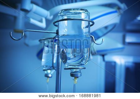 Infusion drip in hospital on blurred background