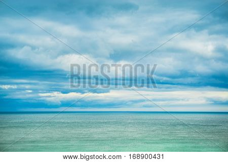 Sea horizon and clouds in the sky.