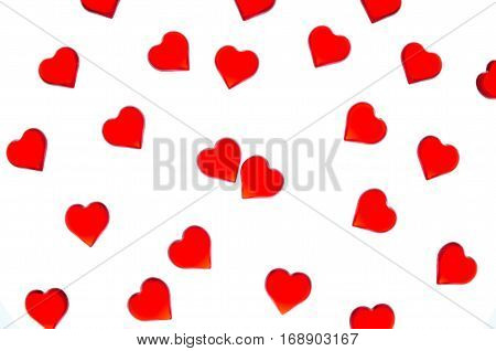 Bright red hearts on a striped background. In order to use Valentine's Day, weddings, International Women's Day