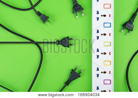 Electrical power strip or extension block and empty outlet tap with switch grounded top view on colorful background and copy space electric equipment flat lay concept.