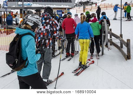HINTERTUX, AUSTRIA - MARCH 29, 2015: The ski lift Sun Jet at the Horberg mountain in Tyrol Austria with people in the queue for a lift to the mountaintop