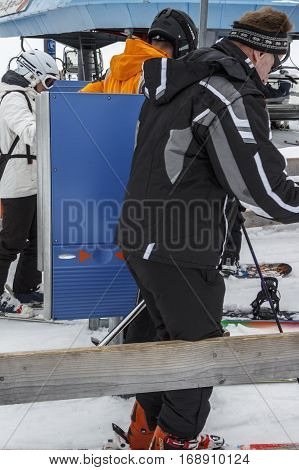 HINTERTUX, AUSTRIA - MARCH 29, 2015: The ski lift Sun Jet at the Horberg mountain in Tyrol Austria with people in the queue for a lift to the mountaintop