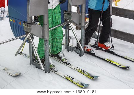 HINTERTUX, AUSTRIA - MARCH 29, 2015: The ski lift Sun Jet at the Horberg mountain in Tyrol Austria with people in the queue for a lift to the mountaintop