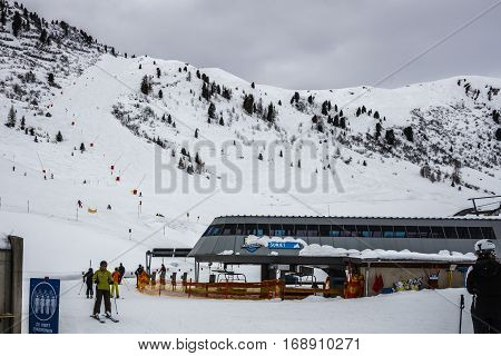 HINTERTUX, AUSTRIA - MARCH 29, 2015: The ski lift Sun Jet at the Horberg mountain in Tyrol Austria with people in the queue for a lift to the mountaintop