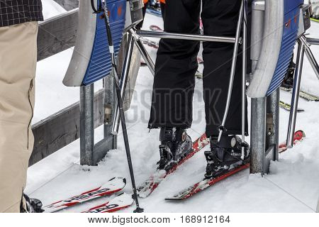 HINTERTUX, AUSTRIA - MARCH 29, 2015: The ski lift Sun Jet at the Horberg mountain in Tyrol Austria with people in the queue for a lift to the mountaintop