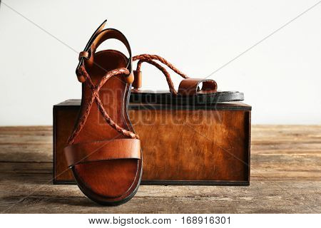 New leather sandals and gift box on the table