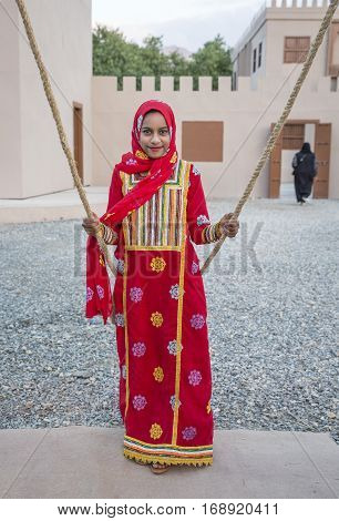 Muscat Oman February 4th 2017: omani girl on a swing