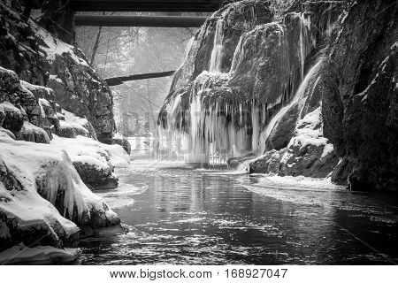 Amazing black and white frozen waterfall in Nera natural park