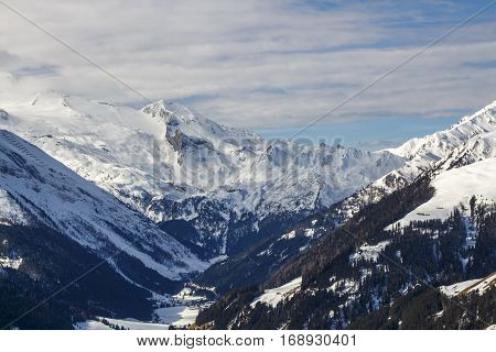 View on the Hintertuxer Glacier (Tuxer Ferner) mountain panorama from Rastkogel cableway in Tyrol Austria with skier in front