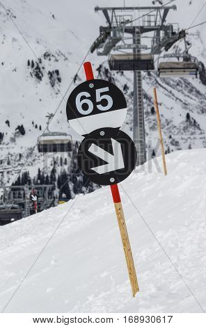 Signpost of a black piste at the Rastkogel mountain (route 65) in the ski region of the Hintertuxer Glacier (Tuxer Ferner) in Tyrol Austria