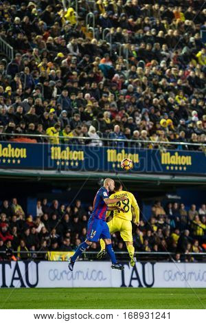 VILLARREAL, SPAIN - JANUARY 8: 14 Mascherano and Sansone during La Liga soccer match between Villarreal CF and FC Barcelona at Estadio de la Ceramica on January 8, 2016 in Villarreal, Spain