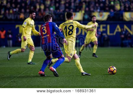 VILLARREAL, SPAIN - JANUARY 8: 18 Sansone, 3 Pique during La Liga soccer match between Villarreal CF and FC Barcelona at Estadio de la Ceramica on January 8, 2016 in Villarreal, Spain