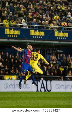 VILLARREAL, SPAIN - JANUARY 8: 14 Mascherano and Sansone during La Liga soccer match between Villarreal CF and FC Barcelona at Estadio de la Ceramica on January 8, 2016 in Villarreal, Spain