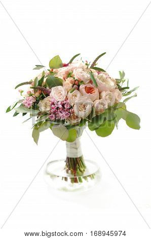 Bridel bouquet with roses in vase on white background
