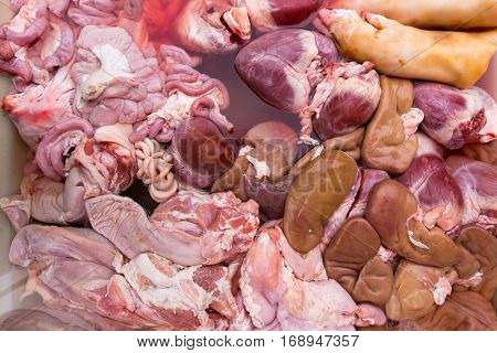 Raw offal and meat background in a thai market